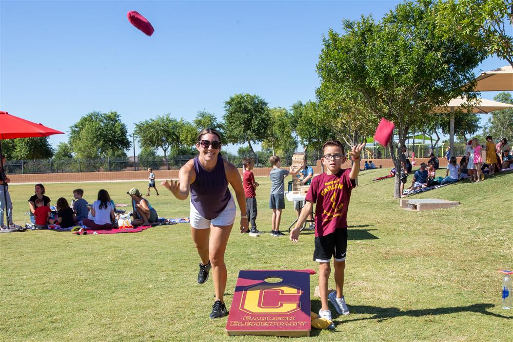 Families visit students during lunch and play games.